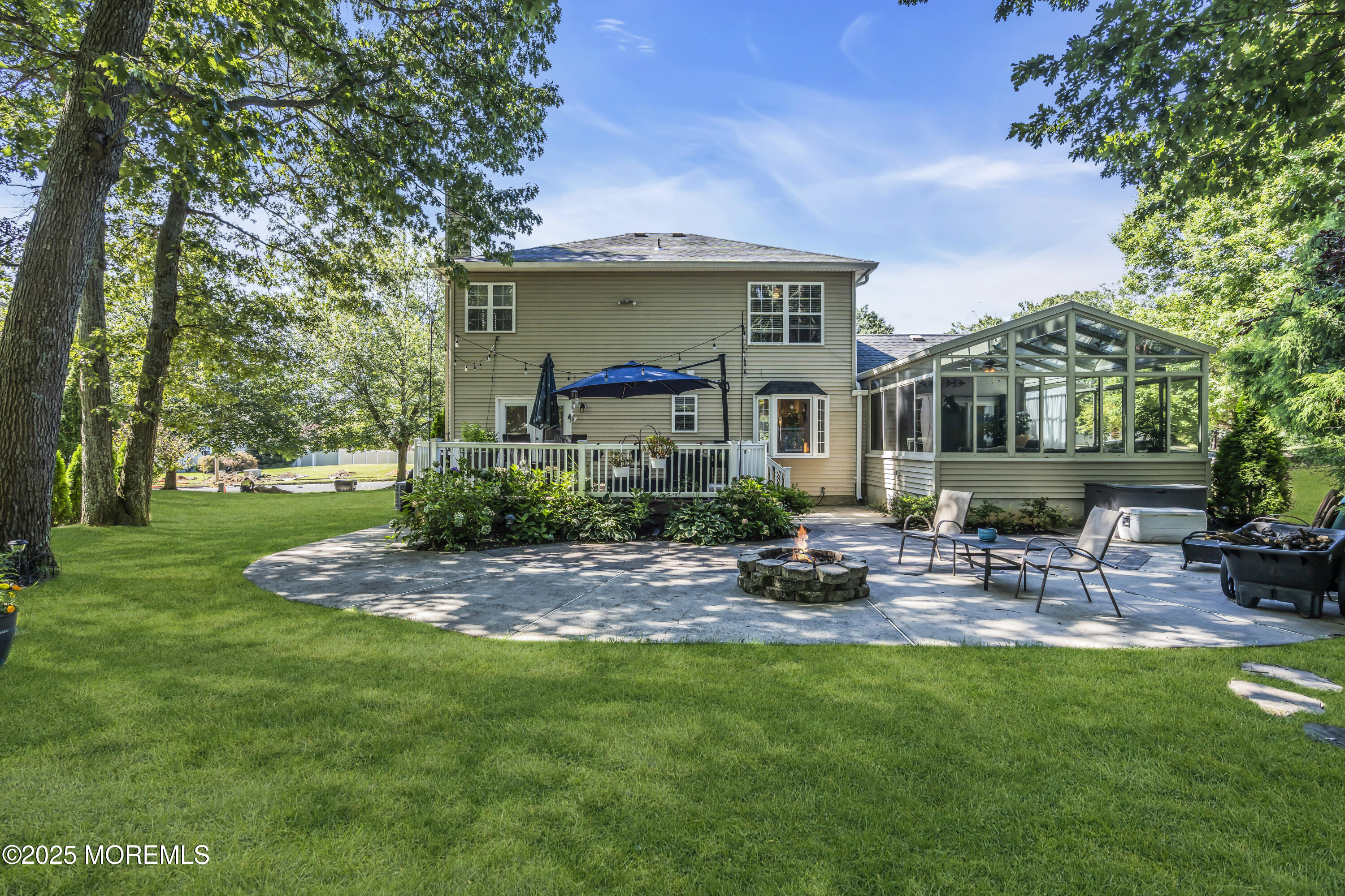 1 Sun Hollow Road Howell, NJ 07731 - Photo 37 of 47 a view of a chair and table in backyard of the house