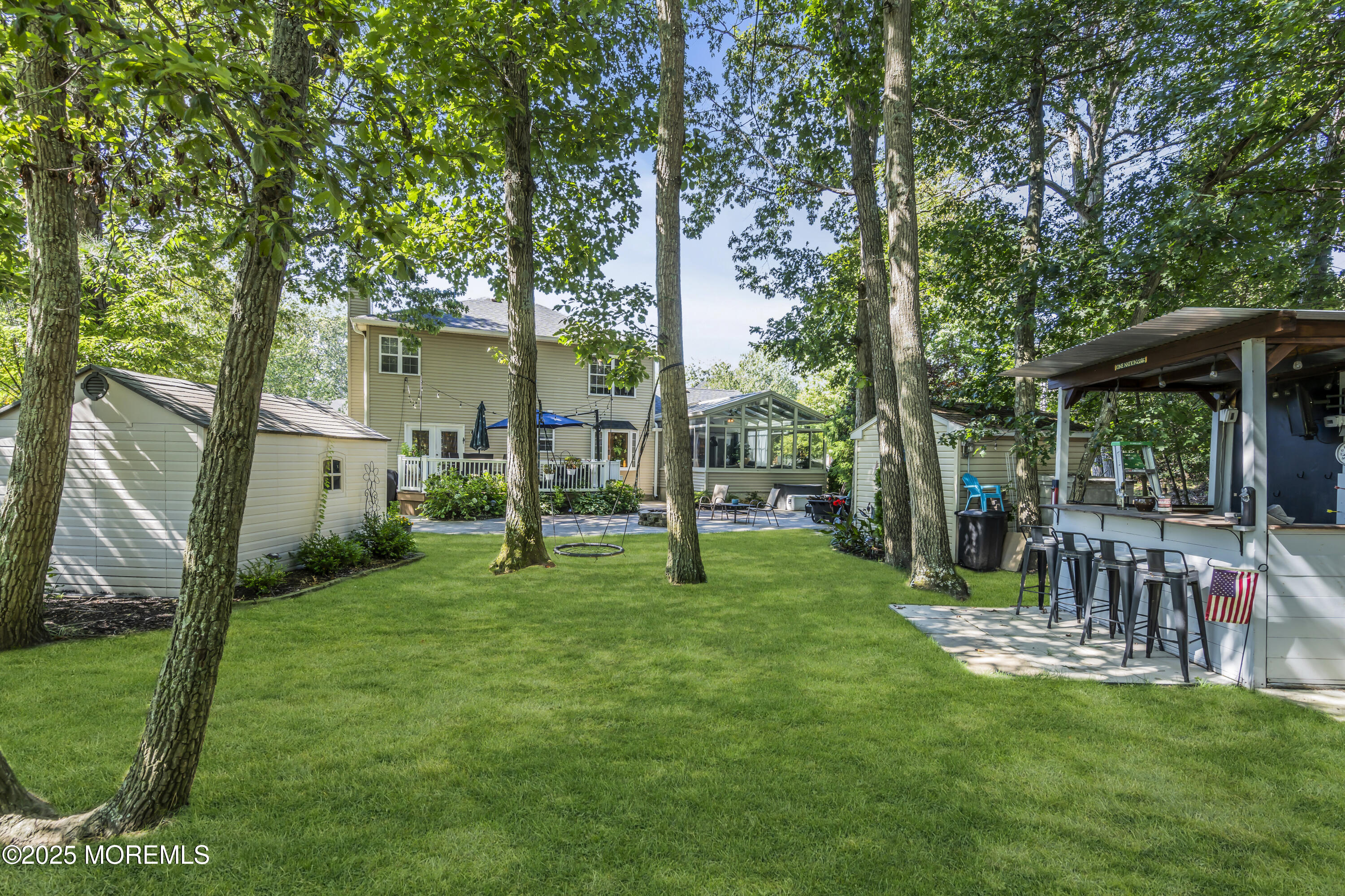 1 Sun Hollow Road Howell, NJ 07731 - Photo 38 of 47 a view of a chair and table in backyard of the house