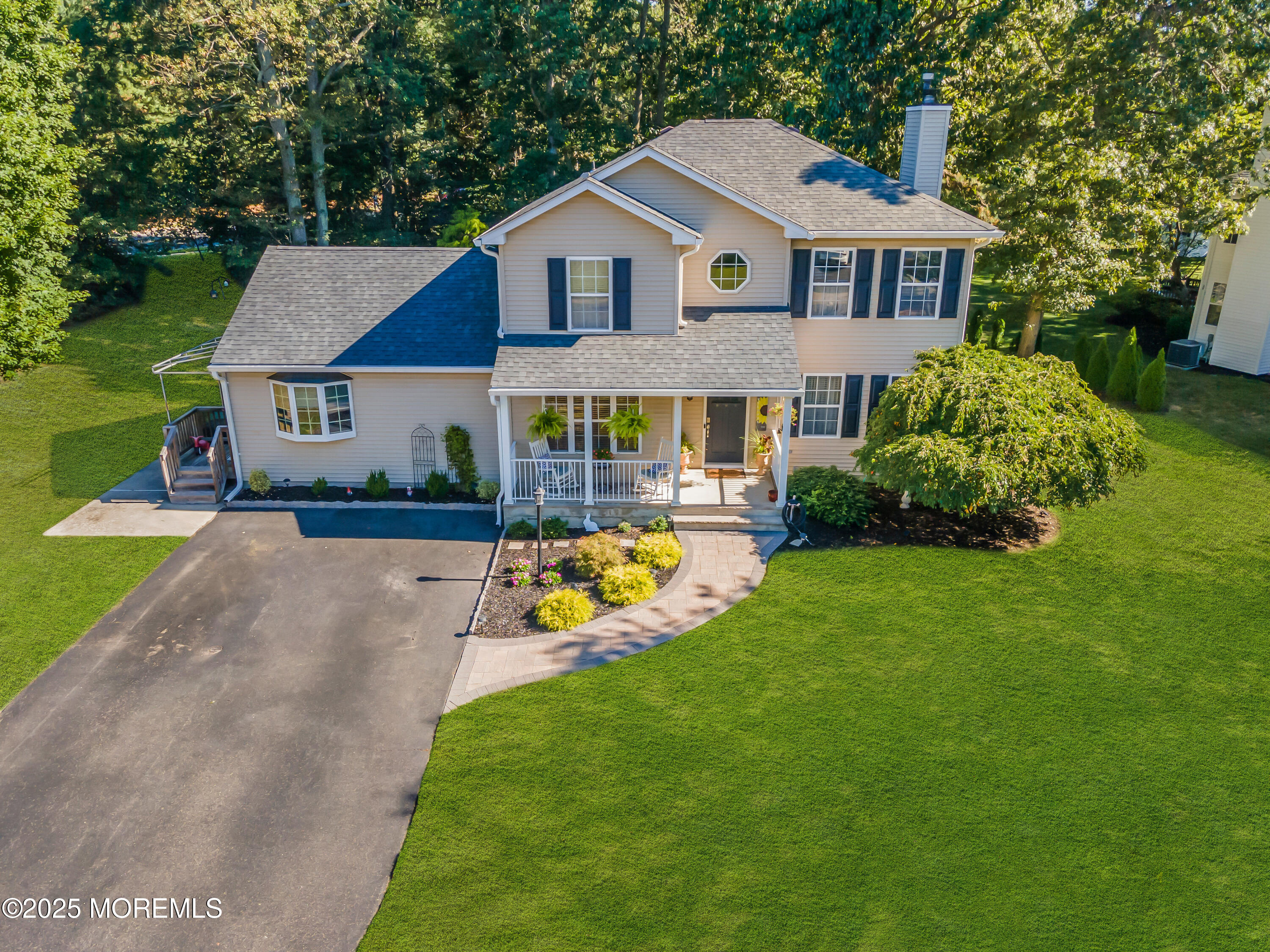 1 Sun Hollow Road Howell, NJ 07731 - Photo 41 of 47 a front view of a house with garden