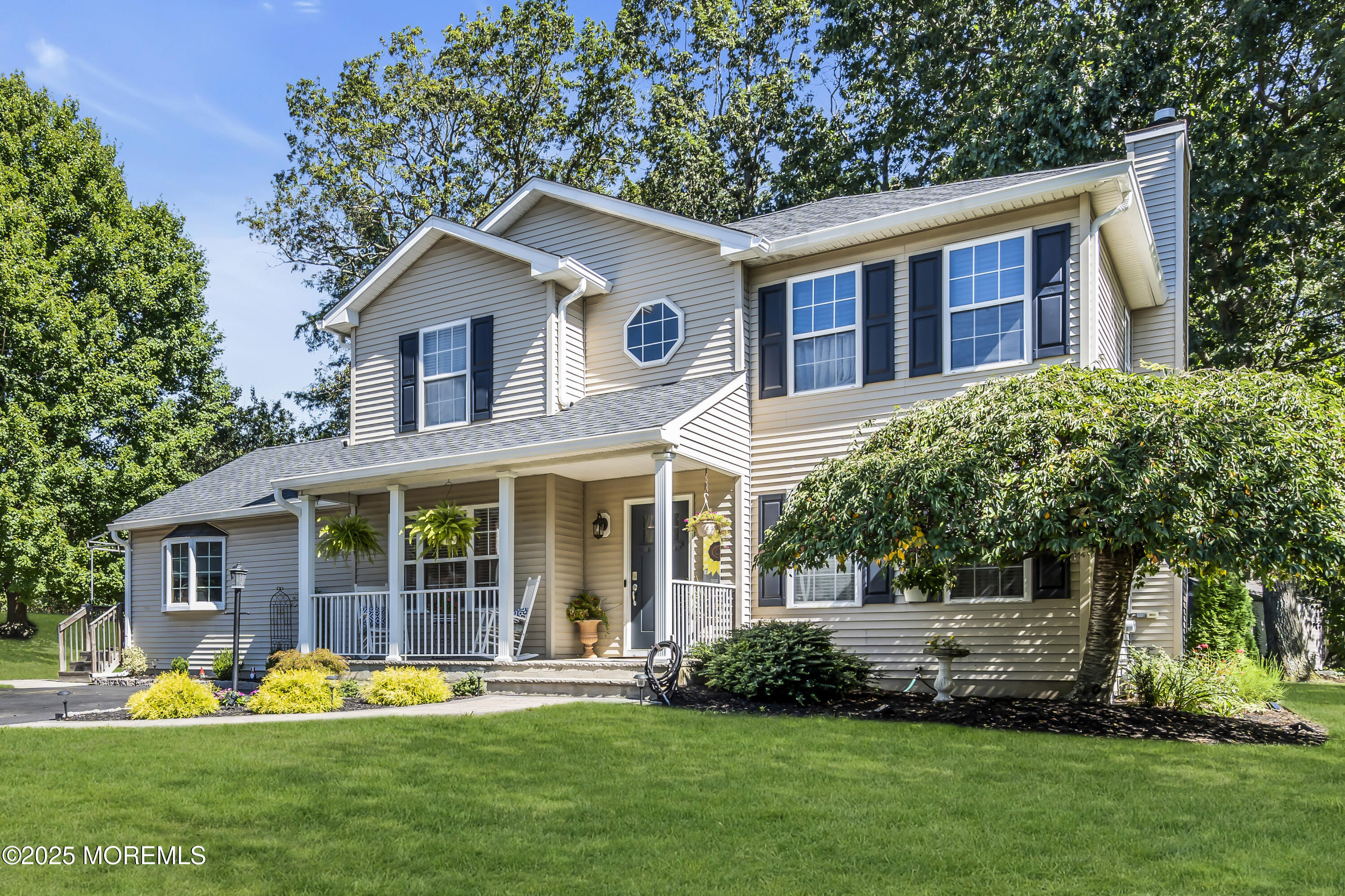 1 Sun Hollow Road Howell, NJ 07731 - Photo 5 of 47 a front view of a house with a yard and trees