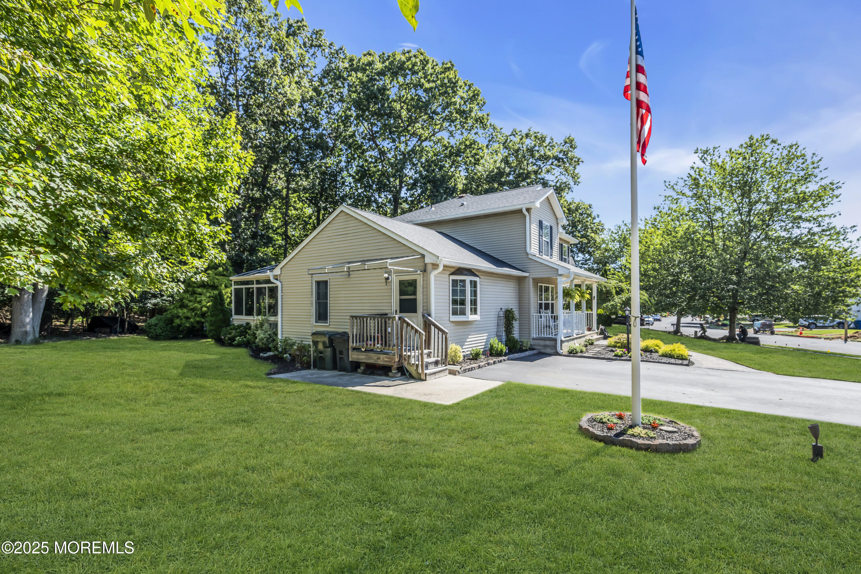 1 Sun Hollow Road Howell, NJ 07731 - Photo 7 of 47 a front view of a house with garden and trees
