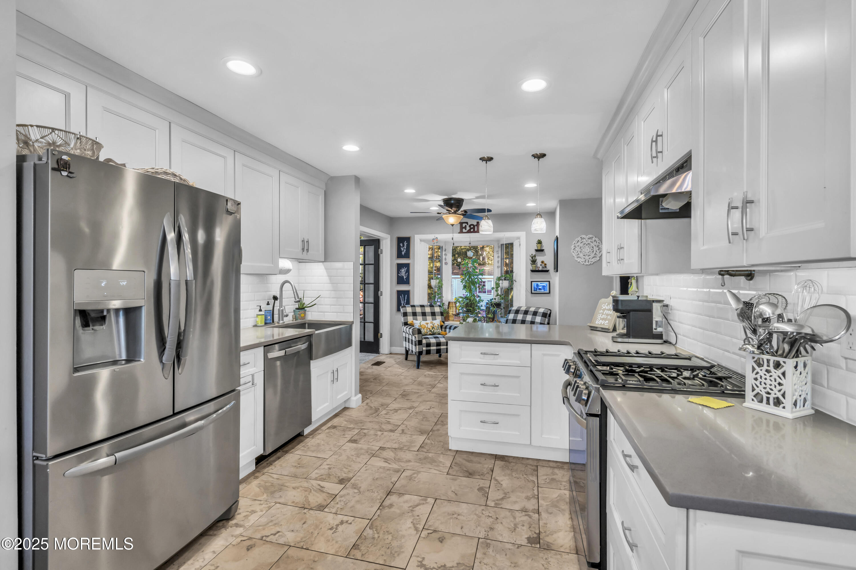1 Sun Hollow Road Howell, NJ 07731 - Photo 9 of 47 a kitchen with granite countertop a refrigerator stove top oven and sink