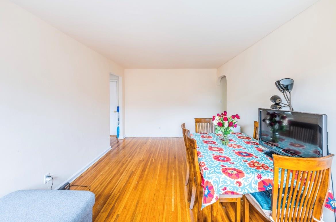 215-43 48th Avenue, Unit 3A Queens, NY 11364 - Photo 5 of 16 a bedroom with a bed and a dresser