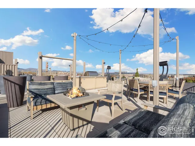 a living room with lots of furniture and a wooden floor