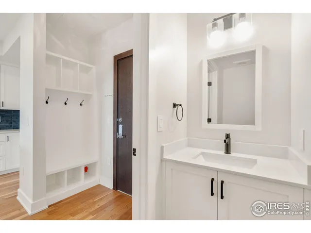 a bathroom with a sink a mirror and a shower