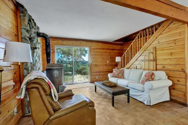 a spacious bedroom with a bed and a ceiling fan