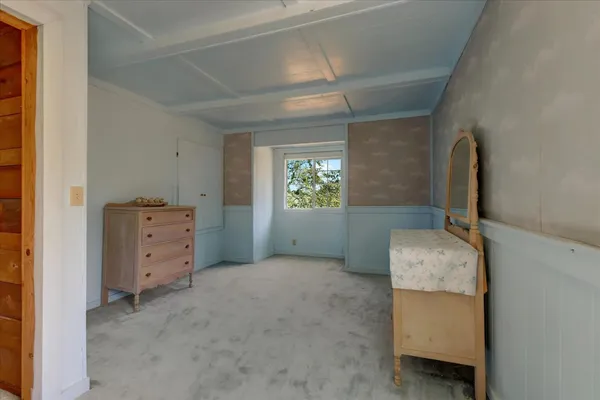 a view of a field with an ocean view