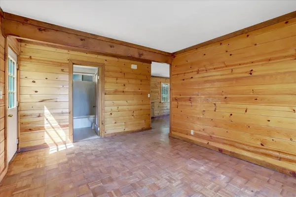 a view of a city with lush green forest