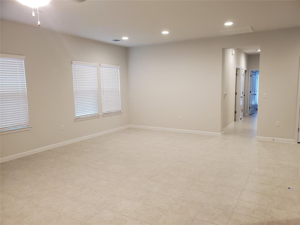 6404 Gunflint Drive Austin, TX 78747 - Photo 14 of 21 Ample floor space and well-lit interiors characterize this inviting living area.