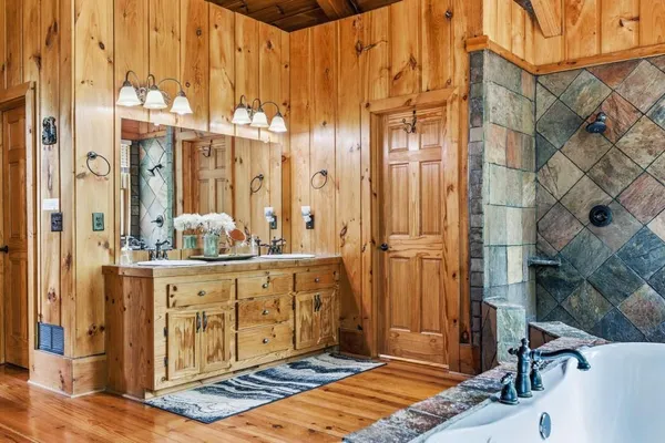 a open kitchen with stainless steel appliances granite countertop a sink a stove and cabinets