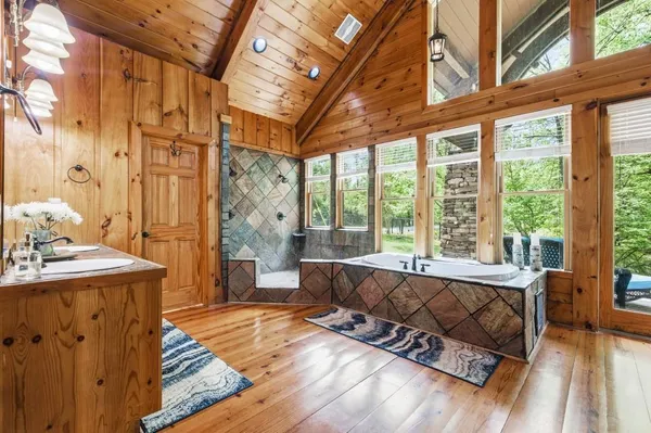a living room with furniture and a floor to ceiling window