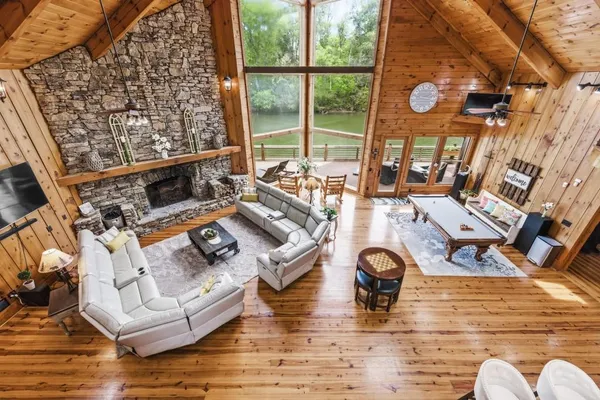 a spacious bedroom with a bed and a large window