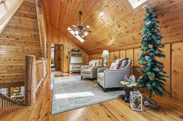 a view of a house with a yard porch and sitting area