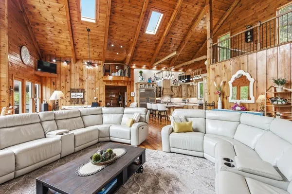 a view of living room with furniture and floor to ceiling window