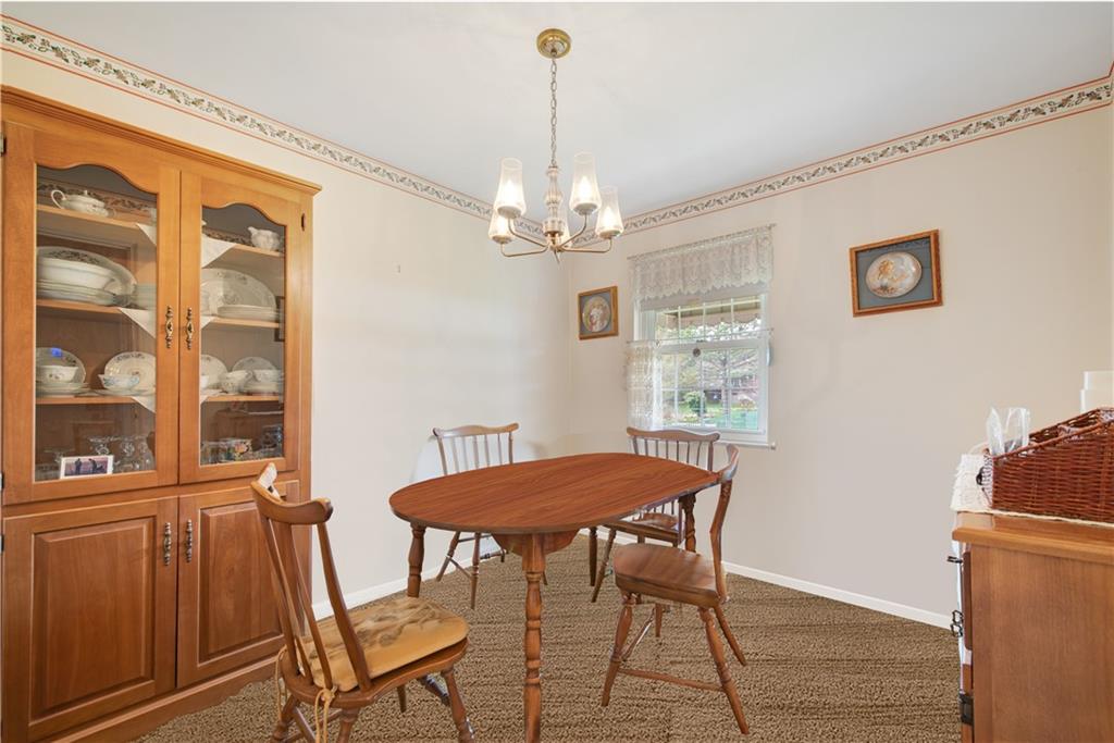 208 Eastern Drive Lower Burrell, PA 15068 - Photo 12 of 25 a view of a dining room with furniture and chandelier