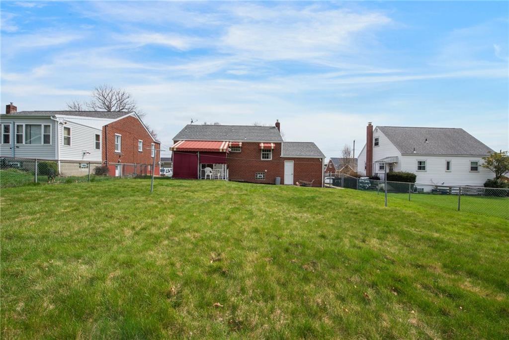 208 Eastern Drive Lower Burrell, PA 15068 - Photo 21 of 25 a view of a house with a big yard and large trees