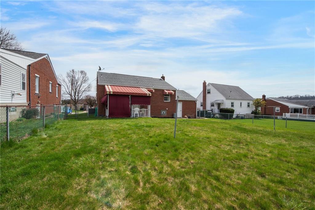 208 Eastern Drive Lower Burrell, PA 15068 - Photo 22 of 25 a aerial view of a house next to a big yard and large trees