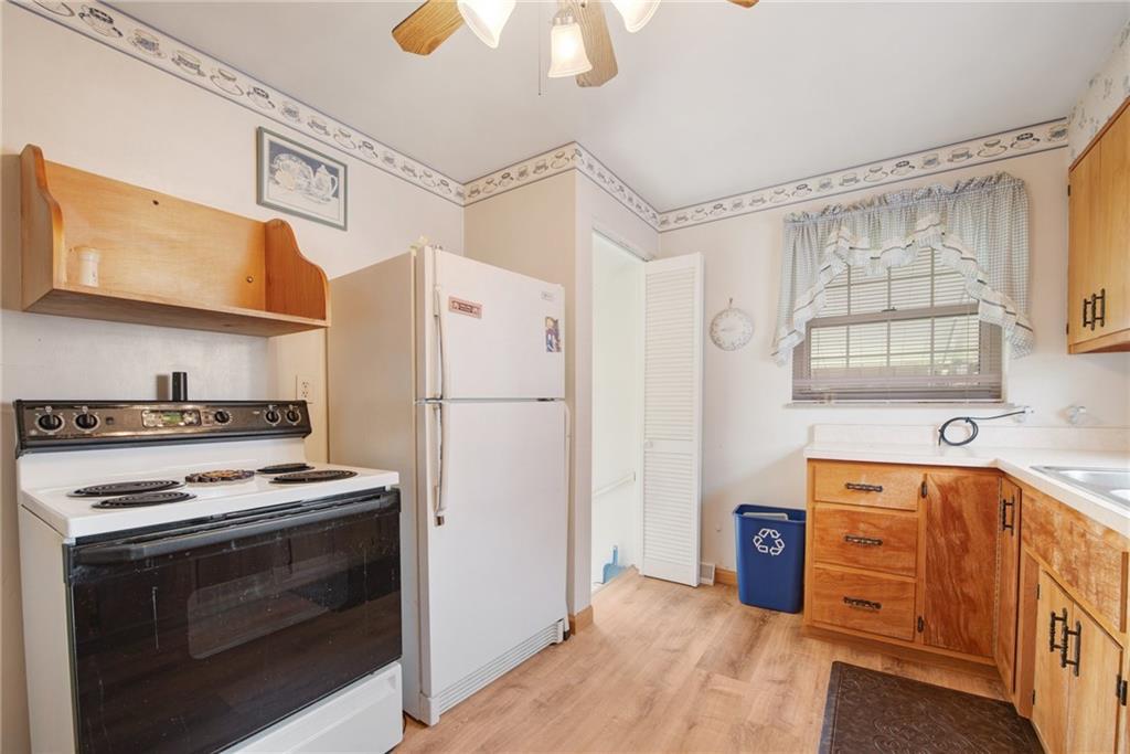 208 Eastern Drive Lower Burrell, PA 15068 - Photo 7 of 25 a kitchen with stainless steel appliances granite countertop a refrigerator and a stove top oven