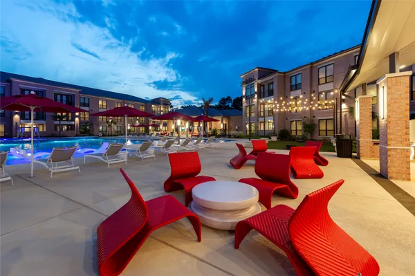 a view of a chairs and tables in patio