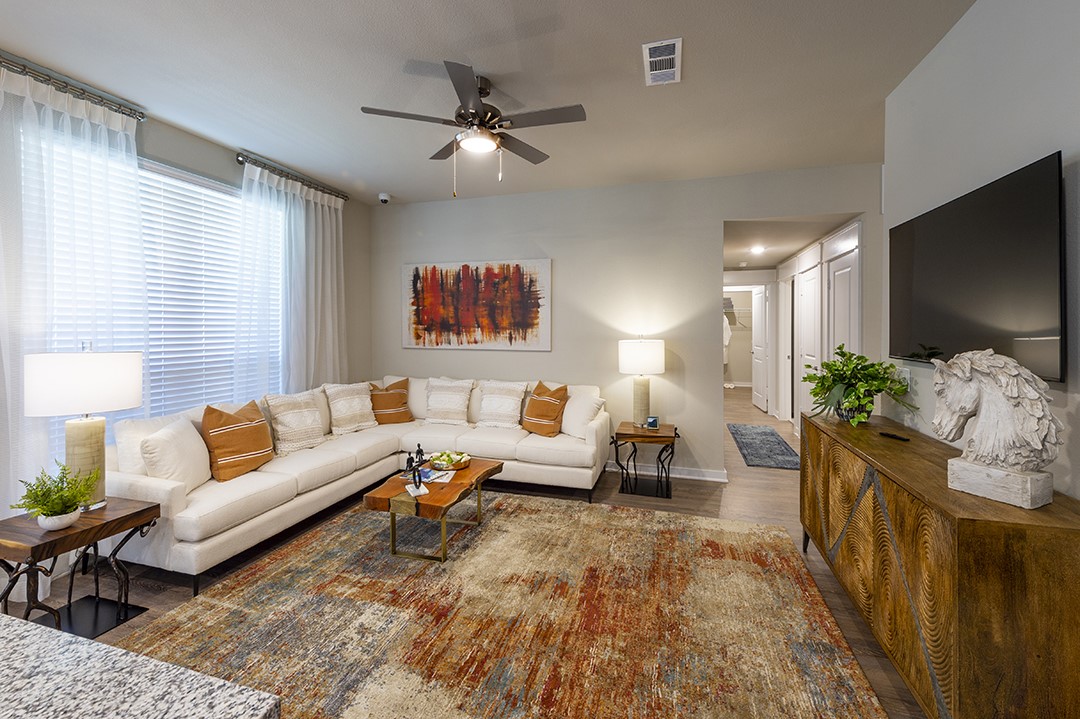 30020 Creekside Ter Drive, Unit 8203 Spring, TX 77386 - Photo 4 of 29 a living room with furniture and a flat screen tv
