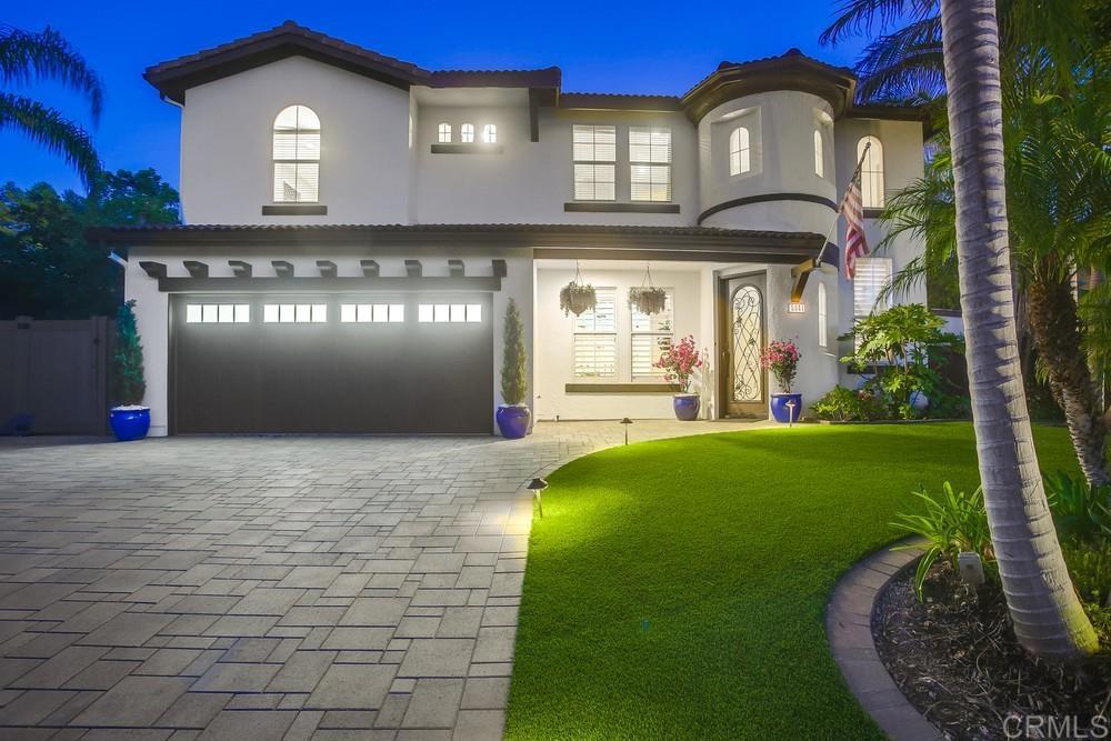 5041 Bella Collina Street Oceanside, CA 92056 - Photo 1 of 31 a front view of a house with a yard and garage