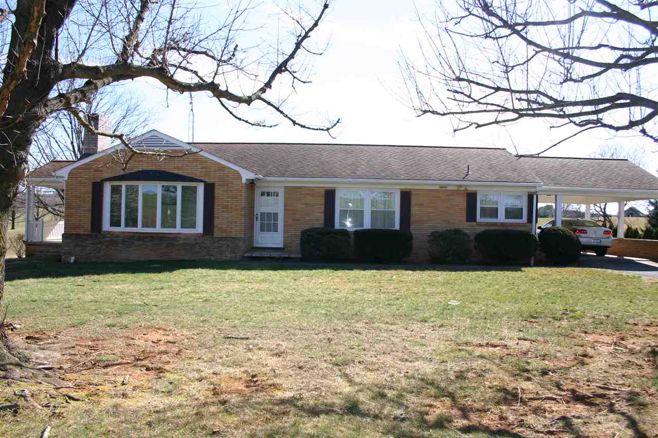86 Fadley Road Weyers Cave, VA 24486 - Photo 1 of 21 a front view of a house with yard