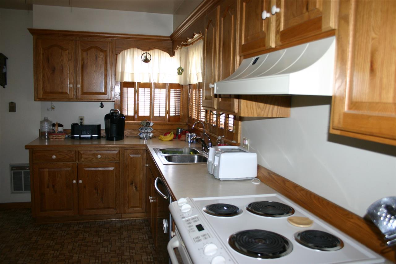 86 Fadley Road Weyers Cave, VA 24486 - Photo 12 of 21 a kitchen with a stove a sink and a microwave
