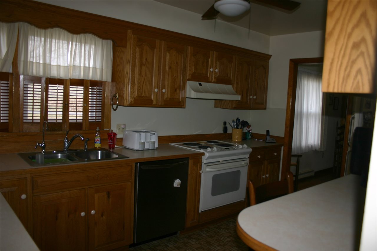 86 Fadley Road Weyers Cave, VA 24486 - Photo 19 of 21 a kitchen with a sink stove and refrigerator