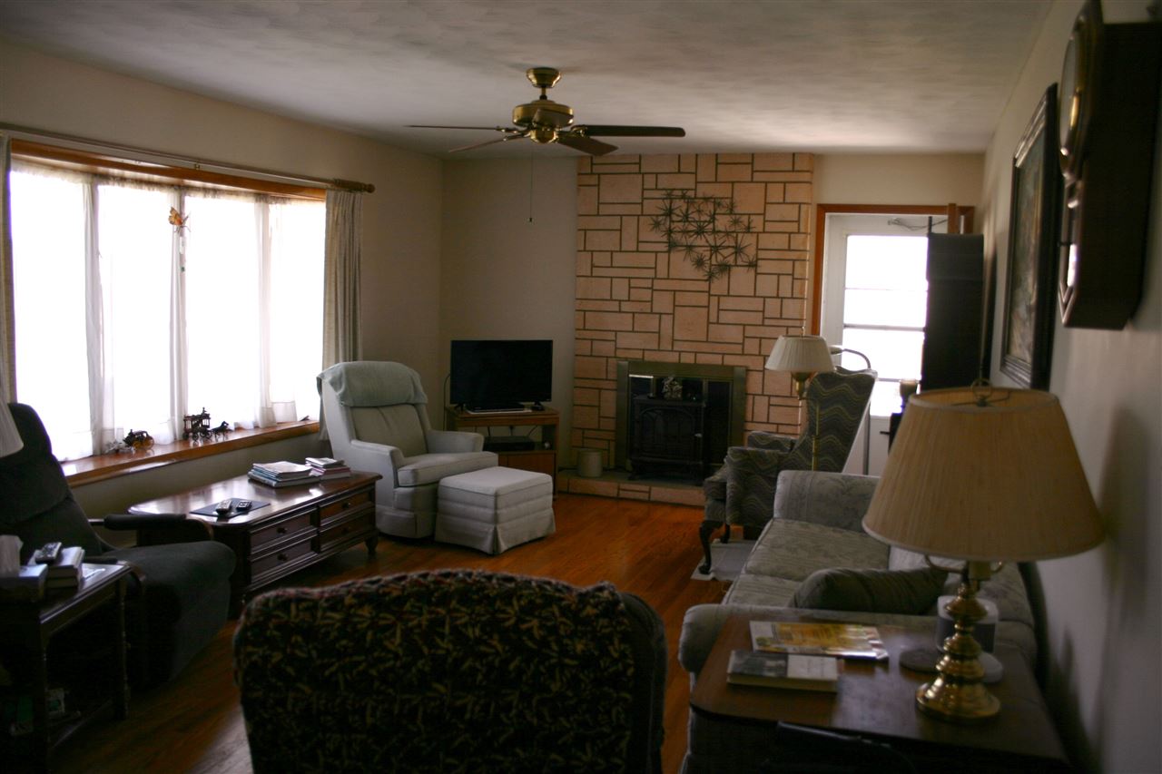 86 Fadley Road Weyers Cave, VA 24486 - Photo 21 of 21 a living room with furniture fireplace and a flat screen tv