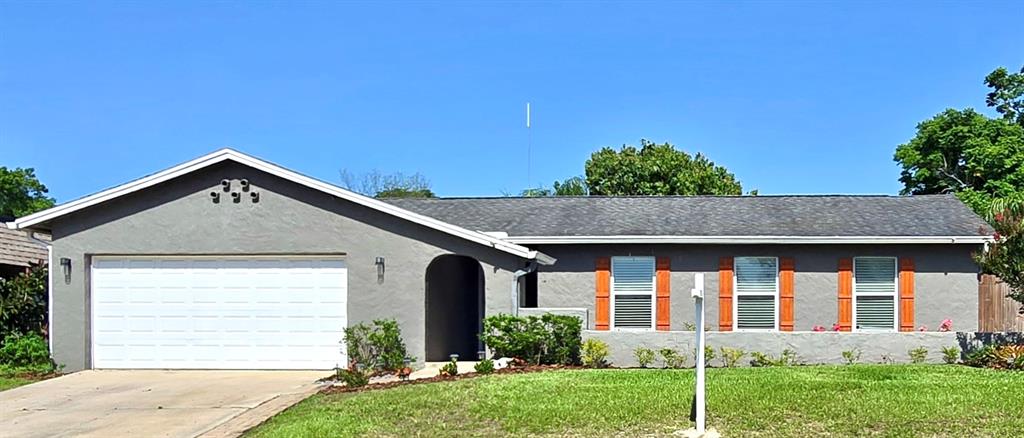 415 Seville Avenue Altamonte Springs, FL 32714 - Photo 1 of 1 a front view of a house with garden