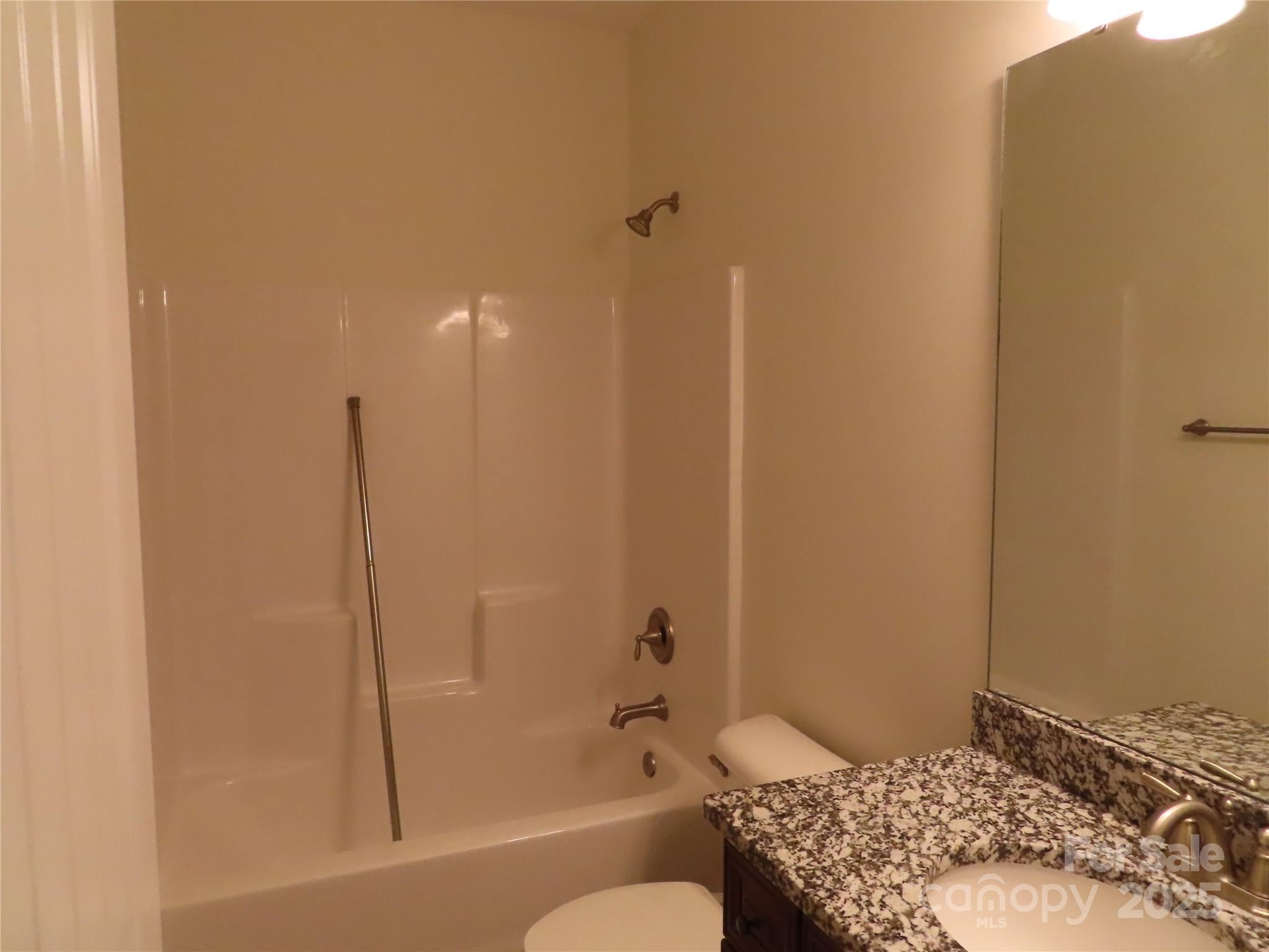 2127 Cedar Road York, SC 29745 - Photo 13 of 23 a bathroom with a granite countertop sink toilet and shower