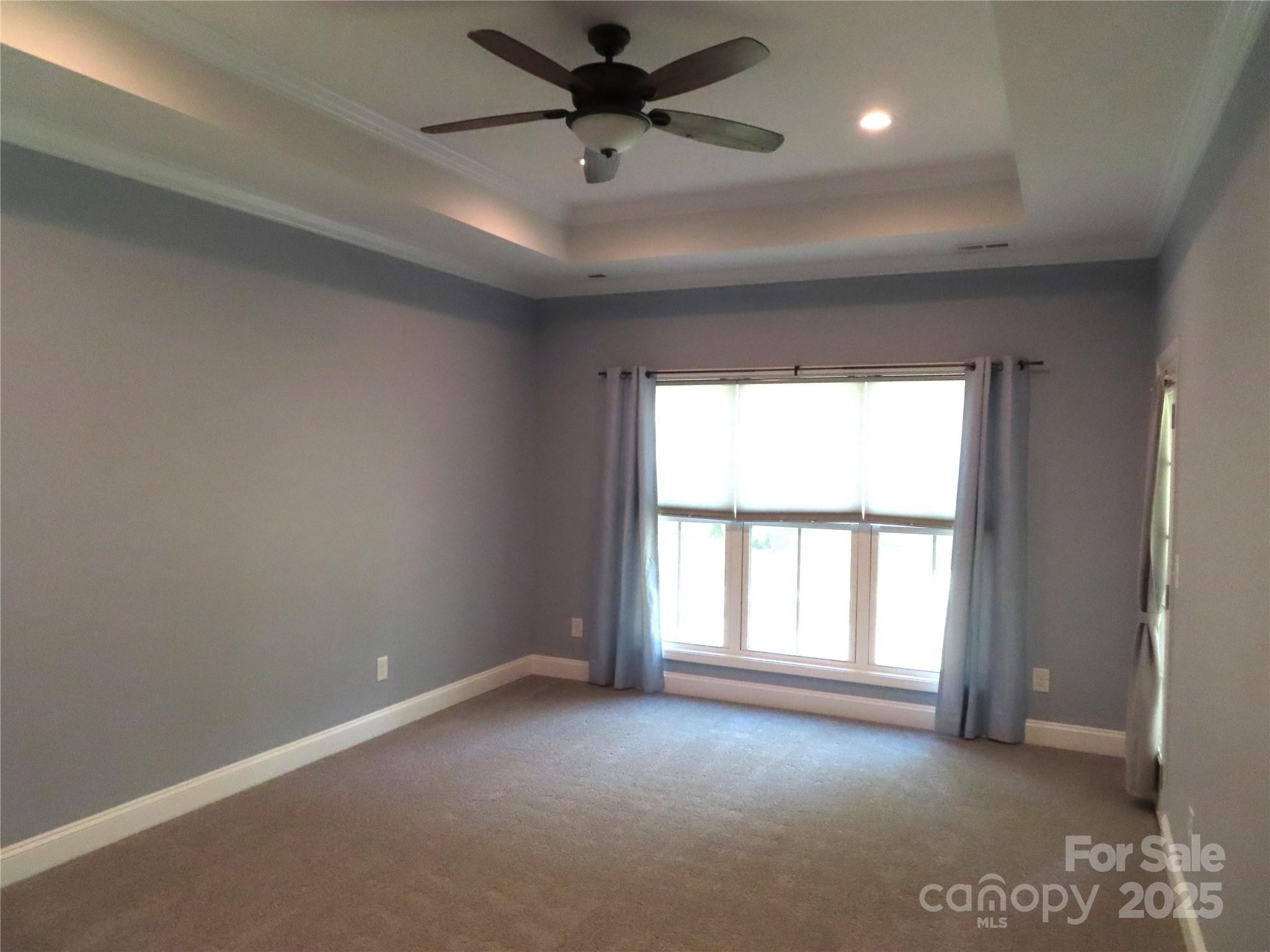 2127 Cedar Road York, SC 29745 - Photo 16 of 23 an empty room with a window and a ceiling fan