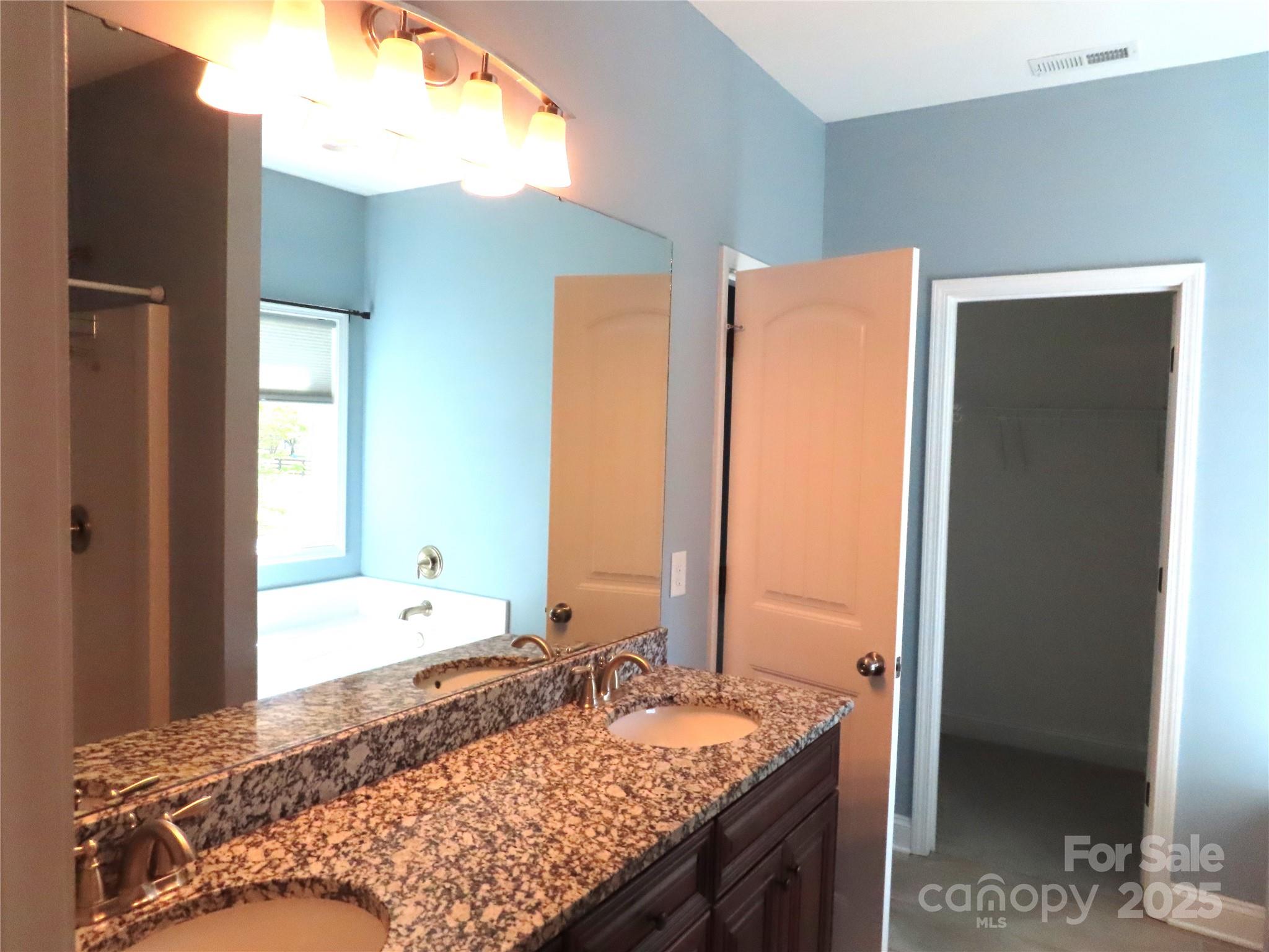 2127 Cedar Road York, SC 29745 - Photo 17 of 23 a bathroom with a granite countertop sink and a mirror