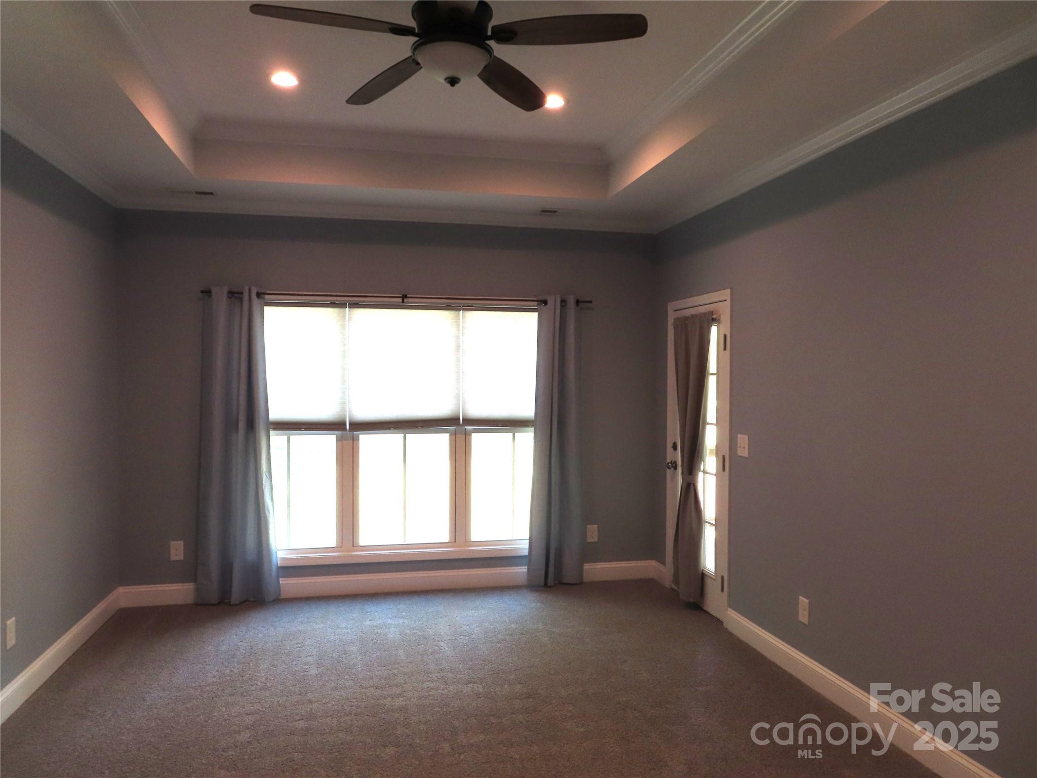 2127 Cedar Road York, SC 29745 - Photo 20 of 23 en empty room with windows and ceiling fan