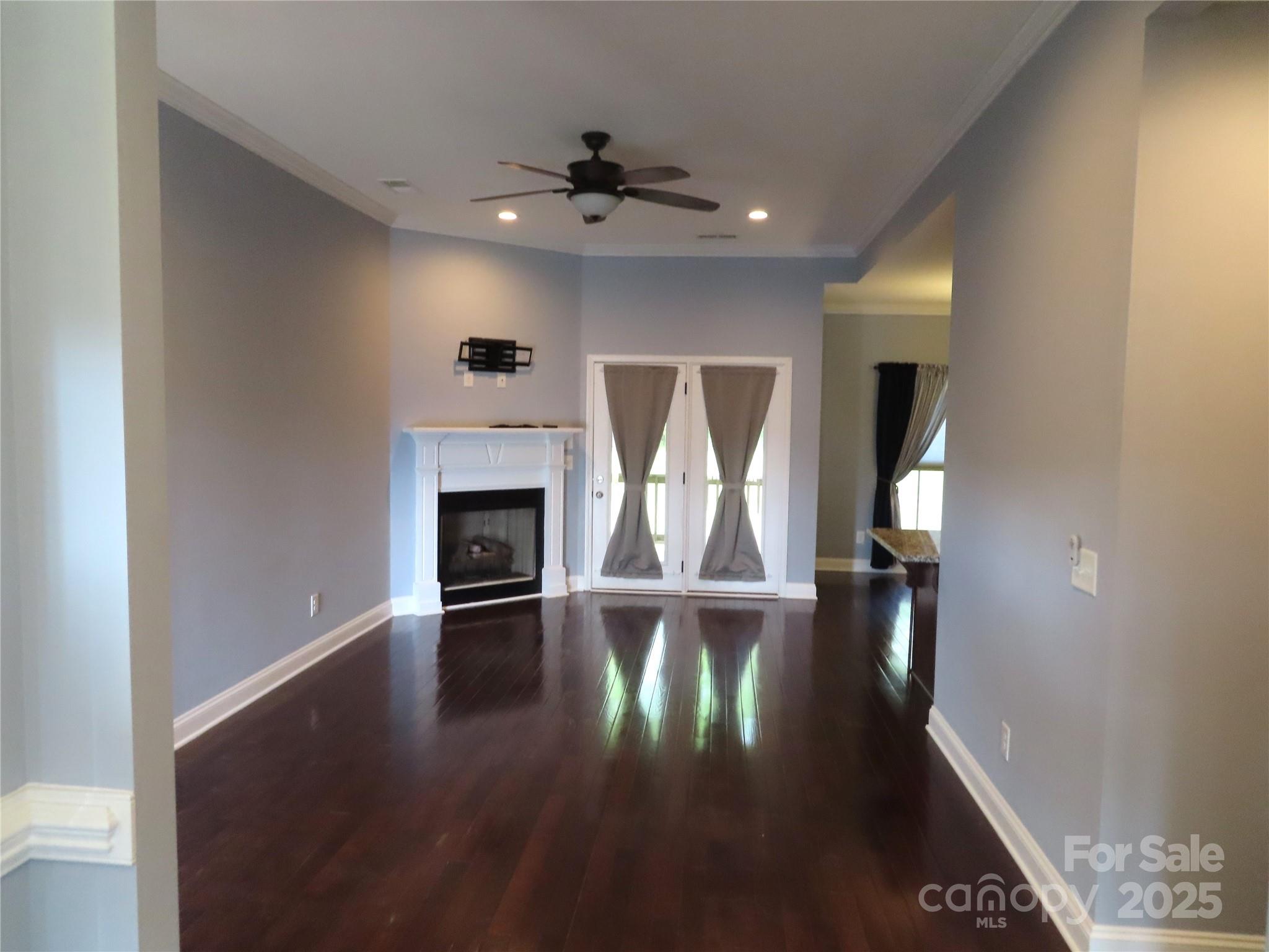 2127 Cedar Road York, SC 29745 - Photo 5 of 23 a view of empty room with wooden floor and fireplace
