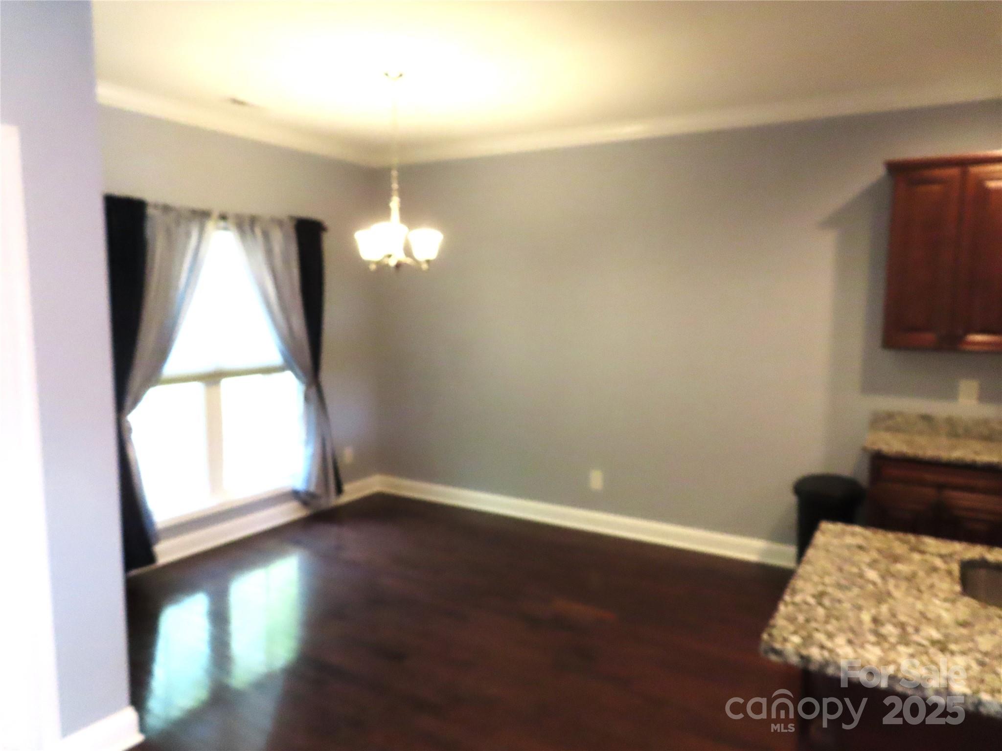 2127 Cedar Road York, SC 29745 - Photo 7 of 23 a view of empty room with wooden floor and fan