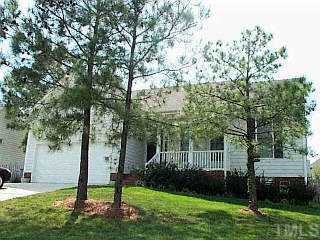 9309 Cub Trail Raleigh, NC 27615 - Photo 1 of 1 a view of a house with backyard and a tree