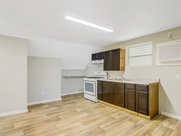 a kitchen with stainless steel appliances granite countertop a stove and a sink