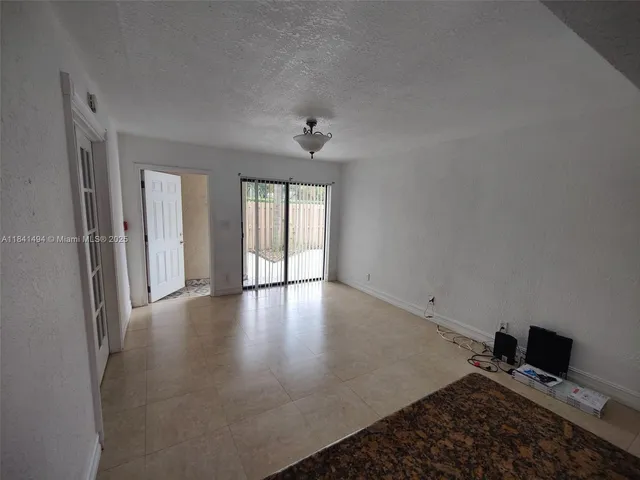 a view of workspace with furniture and window
