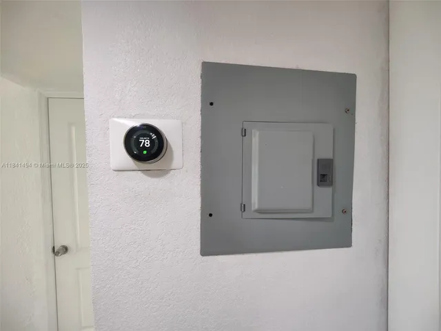 a bathroom with a toilet and a mirror