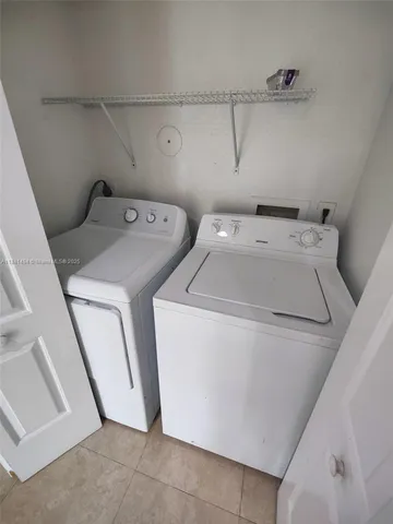a bathroom with a granite countertop sink a mirror a shower and a bathtub