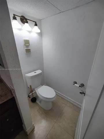 a view of an empty room with a fan