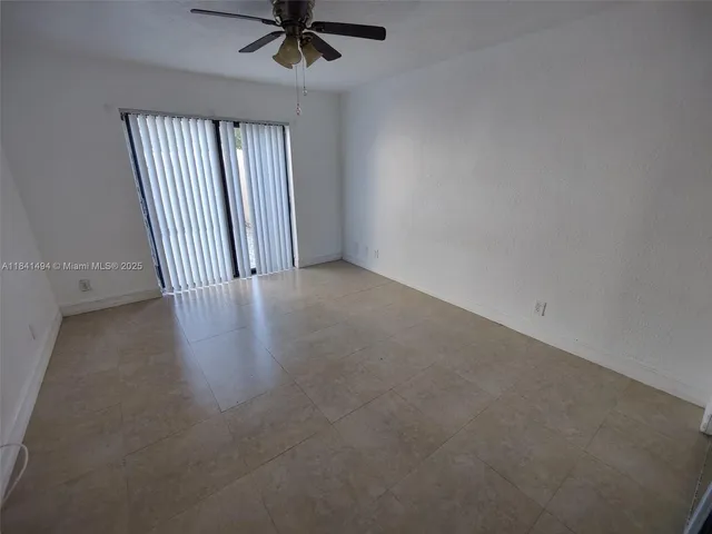 a bathroom with a granite countertop sink mirror toilet and bathtub