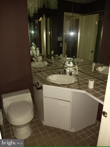 5 Mill Lane Linwood, NJ 08221 - Photo 28 of 44 a bathroom with a toilet sink and mirror