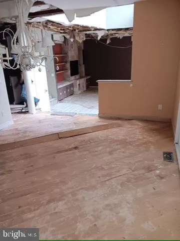 a view of a livingroom with an empty space and a fireplace