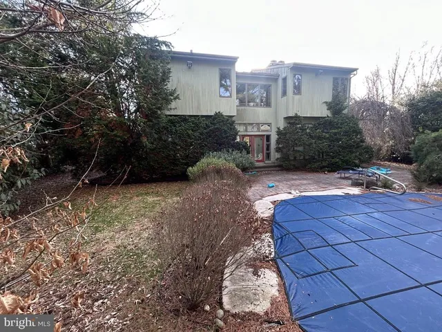 a view of backyard with large trees