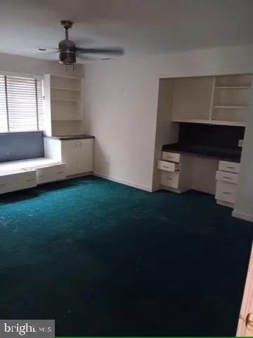 a living room with a couch and a fireplace