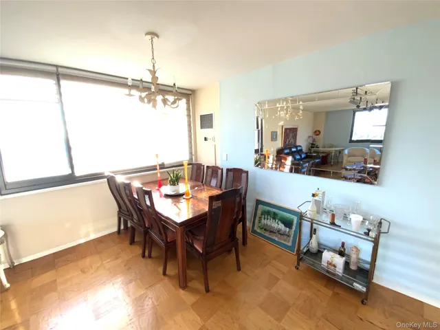 a dining room with furniture and window