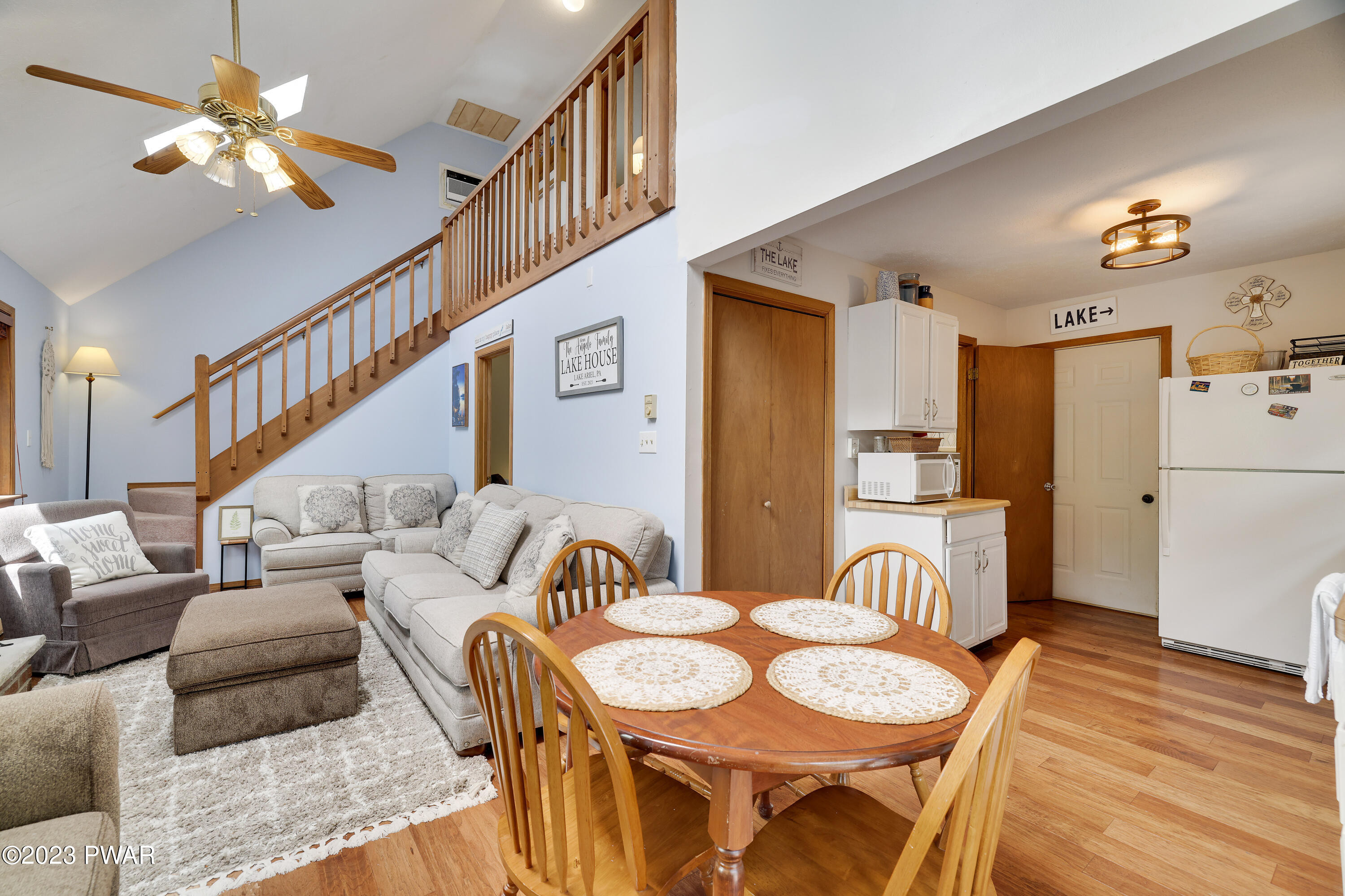 884 Goose Pond Road Lake Ariel, PA 18436 - Photo 6 of 39 a living room with furniture a dining table and a chandelier