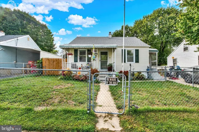 a view of a house with a backyard patio and swimming pool